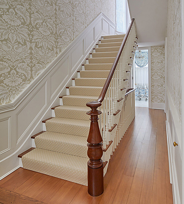 Historic home with staircase and custom millwork wall panels